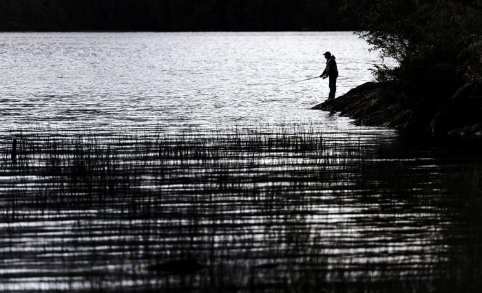 Fisherman by the lake